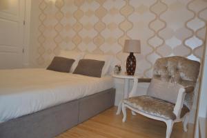 Tempat tidur dalam kamar di Apartamento LM Ribeira