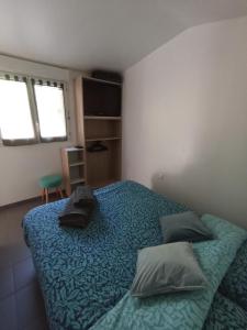 Łóżko lub łóżka w pokoju w obiekcie Gîte Nature et détente