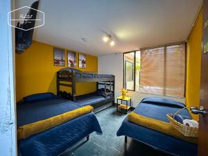 Postel nebo postele na pokoji v ubytování Hotel Habitat Hospedaje