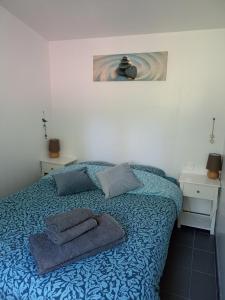 Łóżko lub łóżka w pokoju w obiekcie Gîte Nature et détente