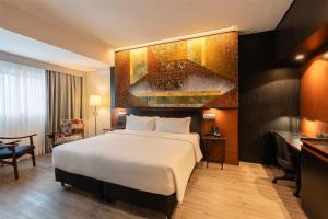 Voodi või voodid majutusasutuse Hilton Garden Inn Asuncion Aviadores Del Chaco toas