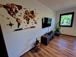 a living room with a world map on the wall at Rebeka Luxury Apartment in Tryavna
