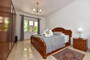 Giường trong phòng chung tại Jessies Guest House Seychelles