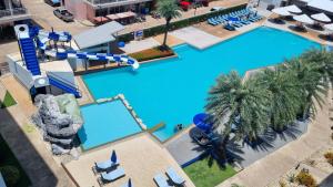 an overhead view of a pool at a resort at Grandblue condominium 205 in Ban Tha Fat