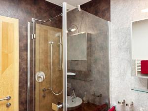 a bathroom with a shower and a sink at Apartment Maiskogel - directly on the ski slope in Kaprun +28 photos