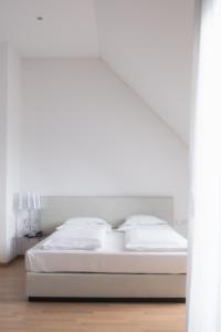 Postel nebo postele na pokoji v ubytování City-Hotel