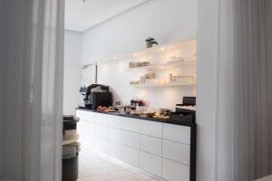 Kuchyň nebo kuchyňský kout v ubytování City-Hotel