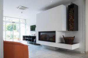 TV a/nebo společenská místnost v ubytování City-Hotel