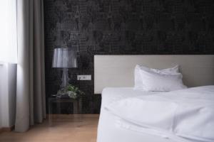 Postel nebo postele na pokoji v ubytování City-Hotel