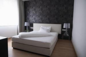Postel nebo postele na pokoji v ubytování City-Hotel