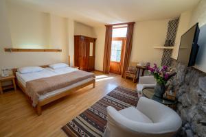 Postel nebo postele na pokoji v ubytování Hotel Mirhav