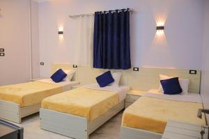 Tempat tidur dalam kamar di Rayan Nubian Guest House