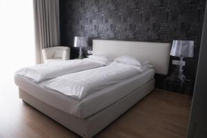 Postel nebo postele na pokoji v ubytování City-Hotel