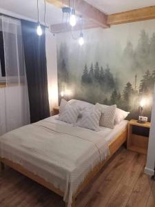 Posteľ alebo postele v izbe v ubytovaní Apartament NA PIĘTERKU