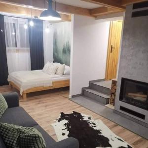 Posteľ alebo postele v izbe v ubytovaní Apartament NA PIĘTERKU