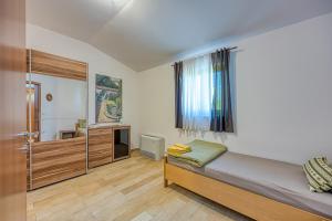 Postel nebo postele na pokoji v ubytování Grad Inn Apartments & Resort