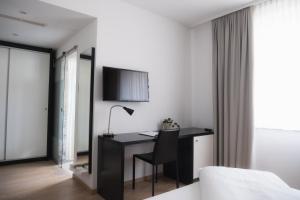 TV a/nebo společenská místnost v ubytování City-Hotel