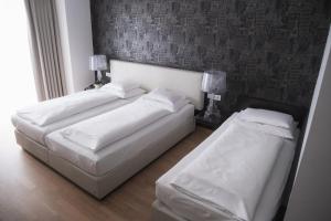 Postel nebo postele na pokoji v ubytování City-Hotel