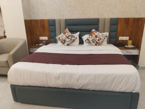 Voodi või voodid majutusasutuse Hotel Phalguna Residency toas