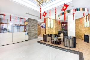 Vstupní hala nebo recepce v ubytování 义乌简爱风尚酒店