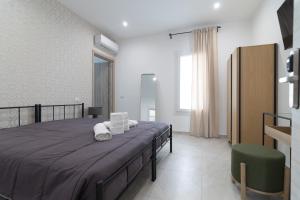 Postel nebo postele na pokoji v ubytování Residenze Miao