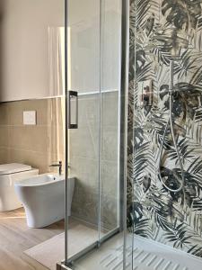 a bathroom with a shower with a sink and a toilet at Vera Hotel in Porto San Giorgio +22 photos