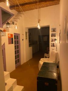 a living room with a couch and a table and lights at Casa Civetta in Stromboli +47 photos
