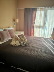 Postel nebo postele na pokoji v ubytování Aparthotel Waldinger Skopje