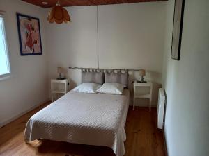 Posteľ alebo postele v izbe v ubytovaní Vue sur L'Ourtizet
