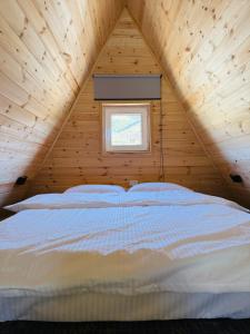 Una cama o camas en una habitación de KolsayNestAframe