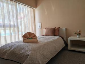 Postel nebo postele na pokoji v ubytování Aparthotel Waldinger Skopje