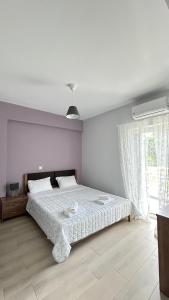 Postel nebo postele na pokoji v ubytování Elsa home