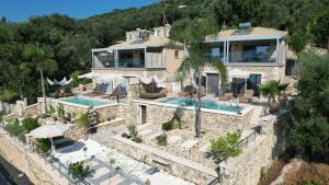 an aerial view of a house with a swimming pool at Goldeneye luxury Villas in Parga