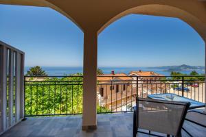 a balcony with a view of the ocean at Apartments Natasa in Sveti Stefan