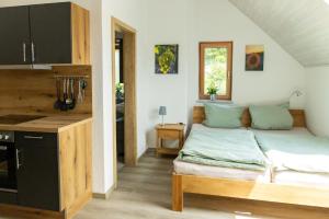 a bedroom with a bed in the corner of a room at Ferienwohnung Pfrang in Michelau