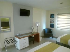 TV a/nebo společenská místnost v ubytování Hotel Tierra Roja