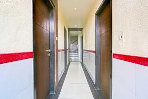 an empty corridor in a building with red walls at Collection O Taragarh Fort in Ajmer