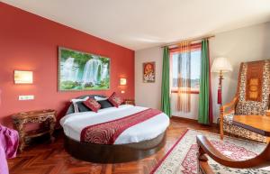 A bed or beds in a room at Hotel Kerala