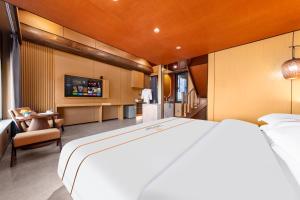 Giường trong phòng chung tại Xingshengjiu Courtyard Hotel Pingyao