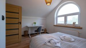 Łóżko lub łóżka w pokoju w obiekcie Apartamenty Sun & Snow Ustroń Przy Rynku