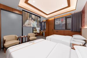 Giường trong phòng chung tại Xingshengjiu Courtyard Hotel Pingyao
