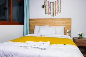 Postel nebo postele na pokoji v ubytování Hotel Litan Machu Picchu