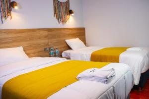 Postel nebo postele na pokoji v ubytování Hotel Litan Machu Picchu