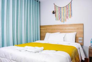 Postel nebo postele na pokoji v ubytování Hotel Litan Machu Picchu