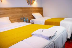 Postel nebo postele na pokoji v ubytování Hotel Litan Machu Picchu