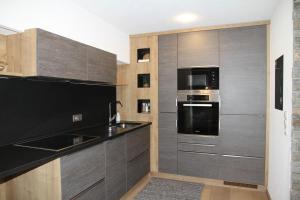 Kuchyň nebo kuchyňský kout v ubytování Appartements Familie Eberharter