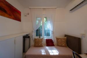 Posteľ alebo postele v izbe v ubytovaní Sunbird Apartman Budapest