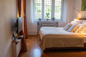 Posteľ alebo postele v izbe v ubytovaní Sunbird Apartman Budapest