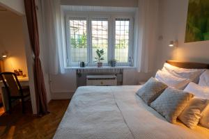 Posteľ alebo postele v izbe v ubytovaní Sunbird Apartman Budapest