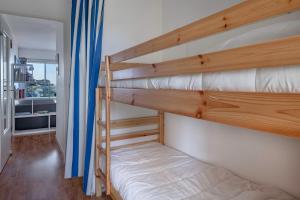 En eller flere senge i et værelse på Face Mer, appartement pour 4 personnes